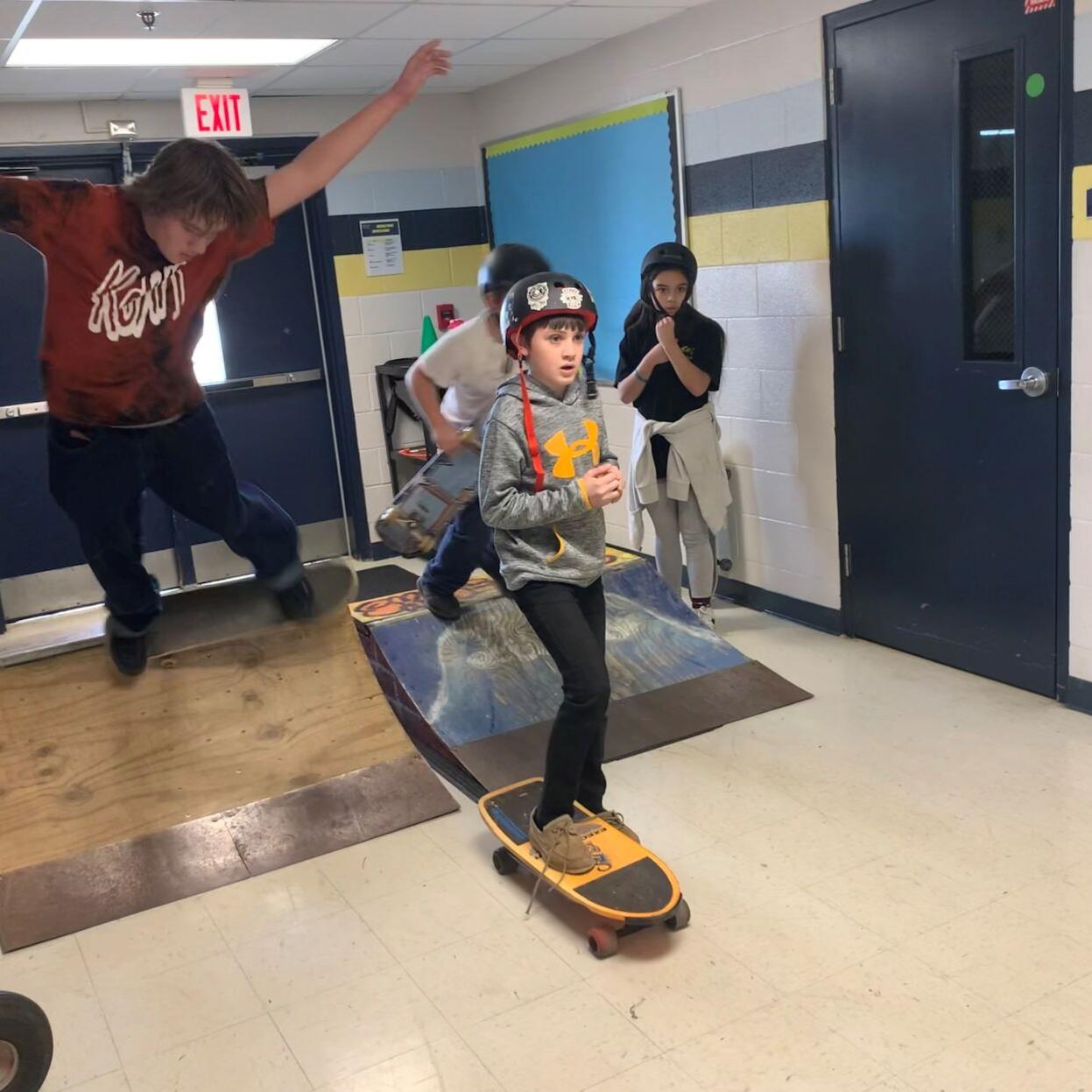 Skateboarding inside East Middle 1